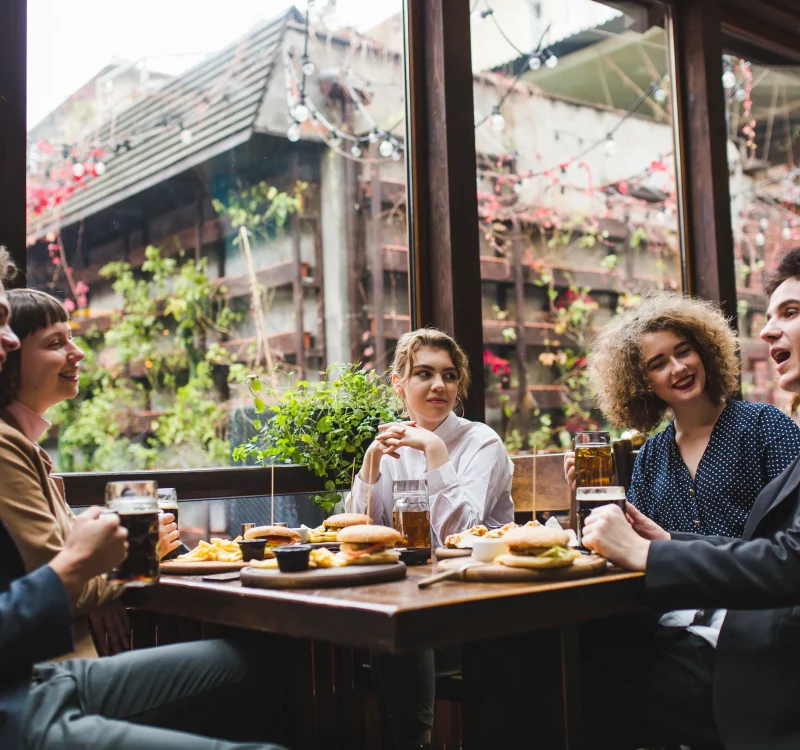 friends-eating-conversating-restaurant (1)